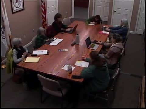 Trustees discuss citizen request on removing library from list of town buildings that permit firearms; action deferred