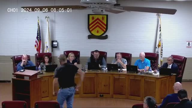 Heated public comment targets police chief and questions scope of failed police‑station referendum