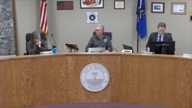 Waupaca council approves updated on-call (captive) pay policy; council members debate including salaried employees