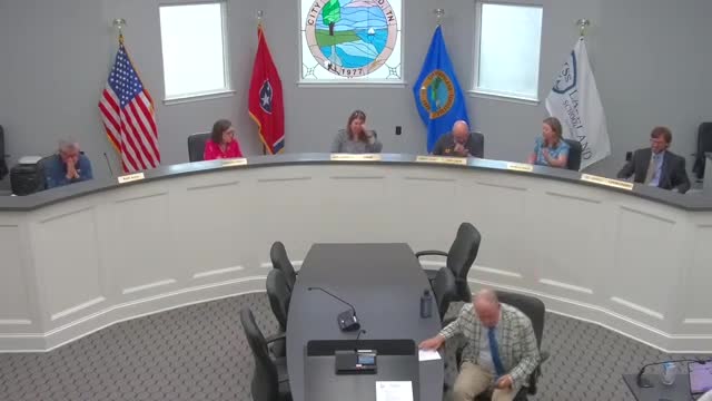 Chair Laura Harrison opens April business meeting with moment of silence