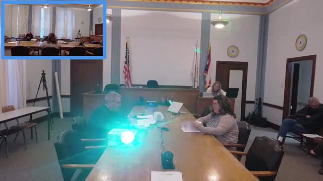 Committee briefed on airport access road and parking grant applications; bids due next week