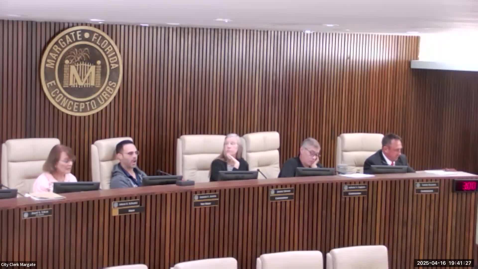 City officials debate iguana control measures amidst public safety concerns