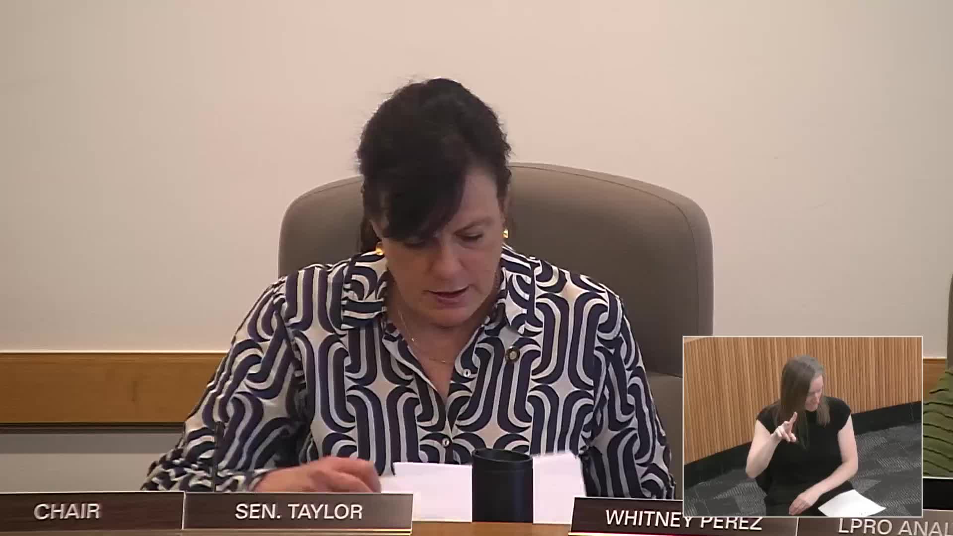 Senate committee adopts clerical amendment to auto‑dealer franchise bill and sends bill to the floor