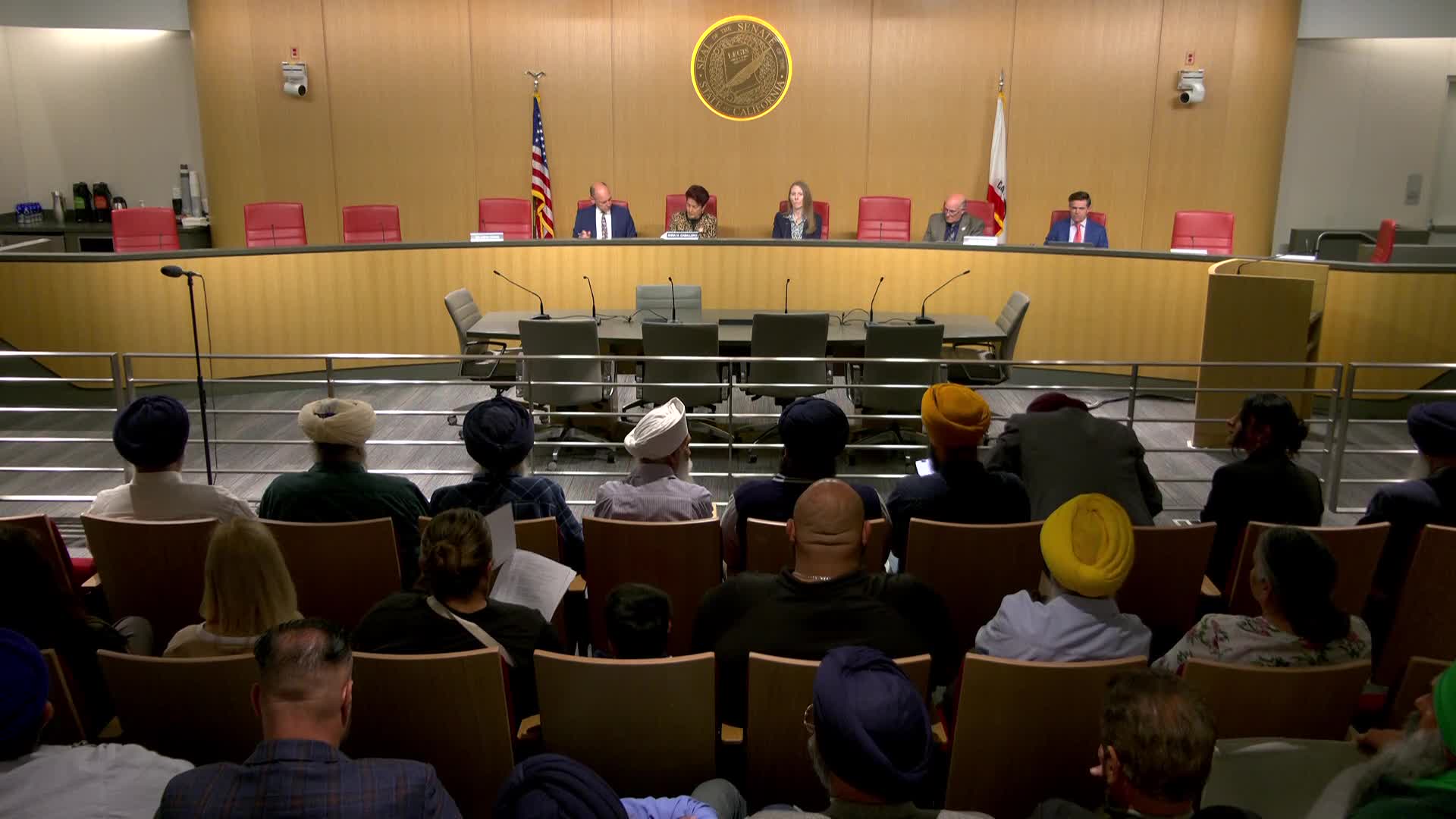 Large public turnout urges support for SB 509 on transnational repression; bill moved to suspense