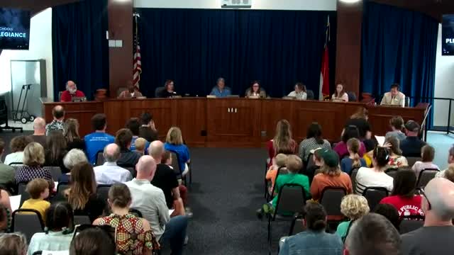 Asheville City Schools Board honors student and discusses Senate Bill 131 funding