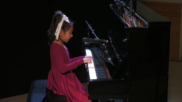 Clementine impresses with piano performance at community talent show