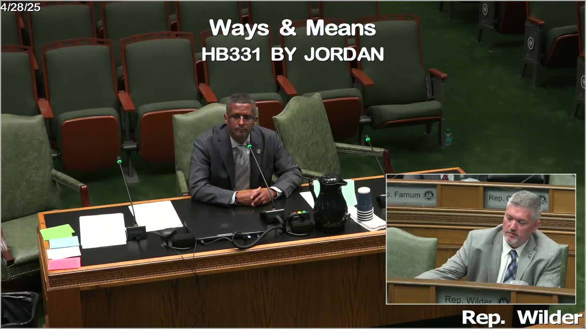 Representative Foner questions funding for tax relief proposal during committee meeting