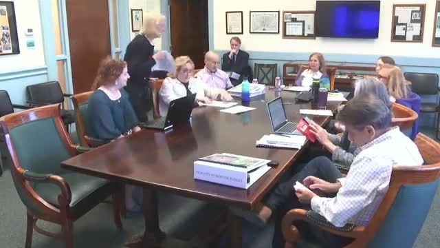 Chair Susan Woonen leads discussion on upcoming community initiatives