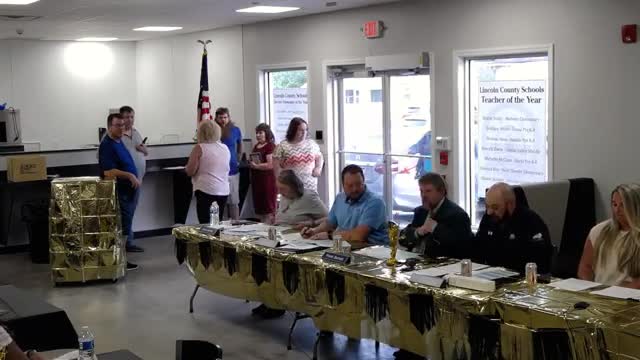 Board approves minutes, consent agenda, finance and personnel items; tables employee hearing