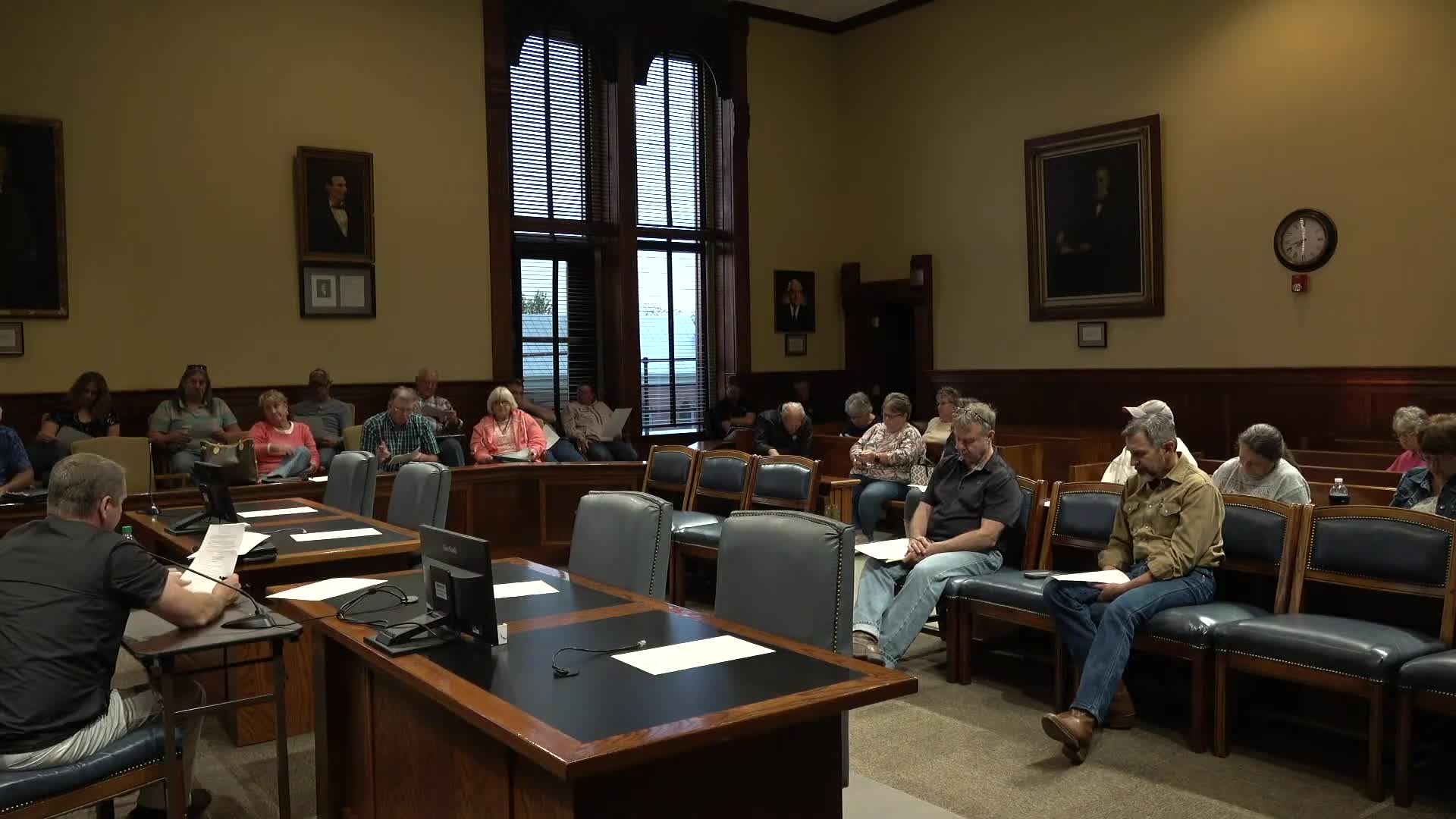 Board approves 15-month audit resolution as state warns grants could be put on stop-pay list