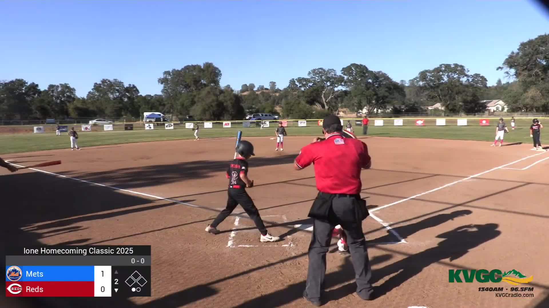 Reds dominate second inning scoring four runs against Mets in youth baseball game