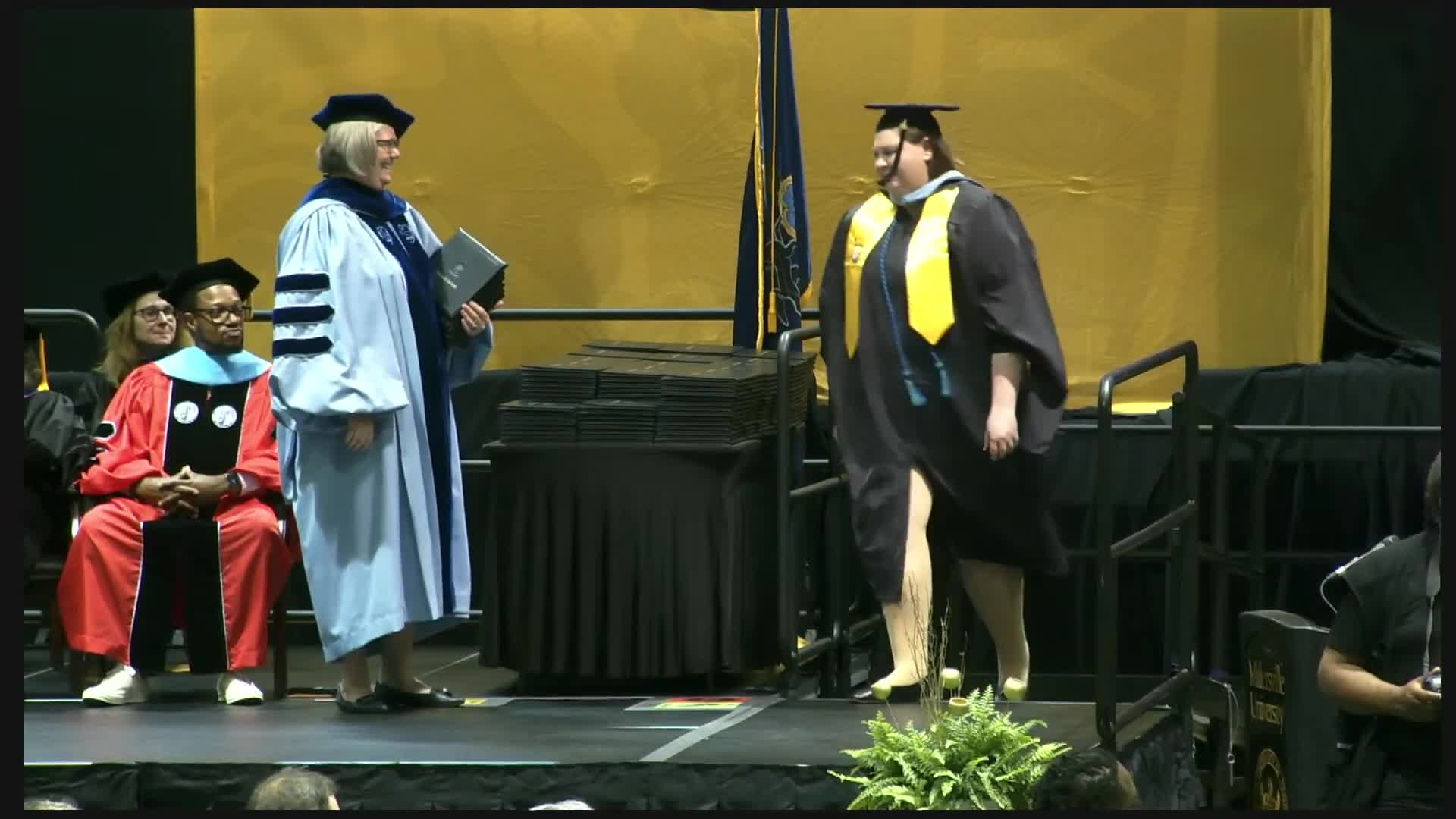 Graduation ceremony honors 100 graduates from various education and social work programs