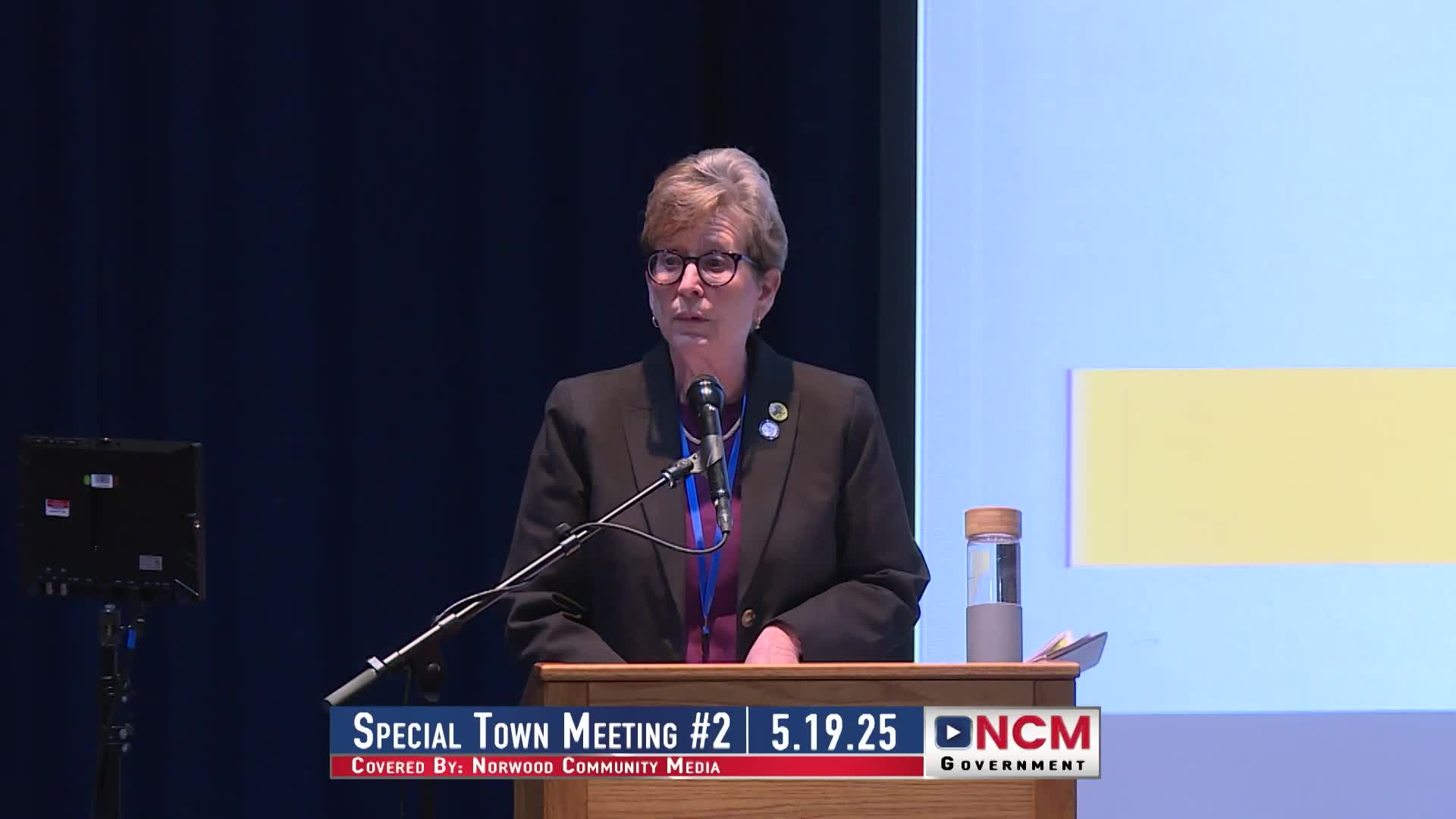 Deputy Chief Cody leads Pledge at Town Meeting with electronic voting demonstration