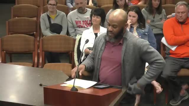 Resident urges board to remove racial‑balance language from open‑enrollment policy