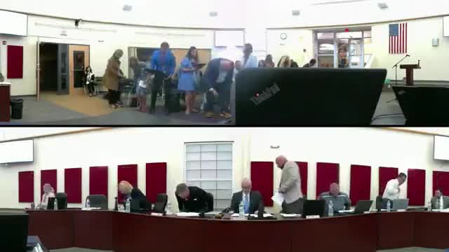 Doctor Dearman leads public participation at school board meeting