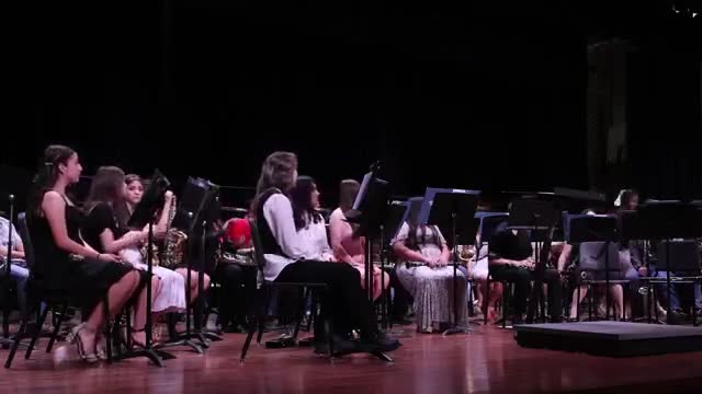 Perinton High School band director honors staff and supporters at farewell performance
