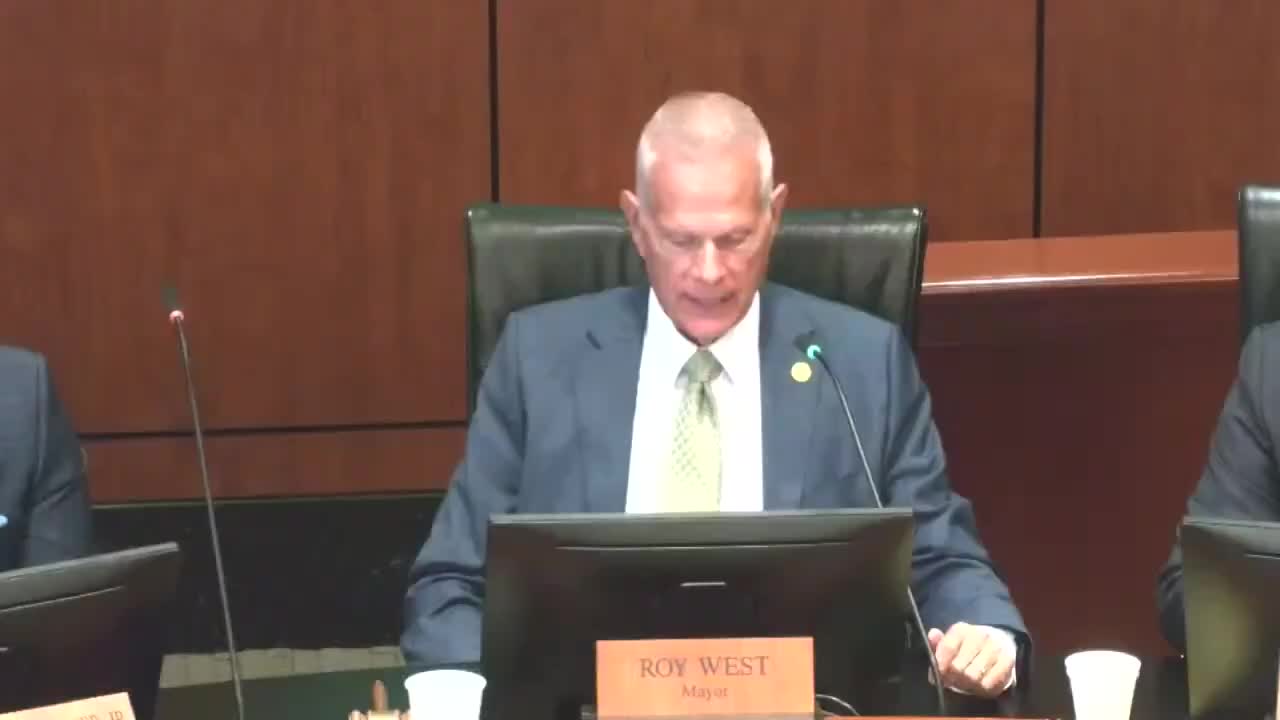 Pastor John R Adolph offers prayer for unity at Beaumont city meeting