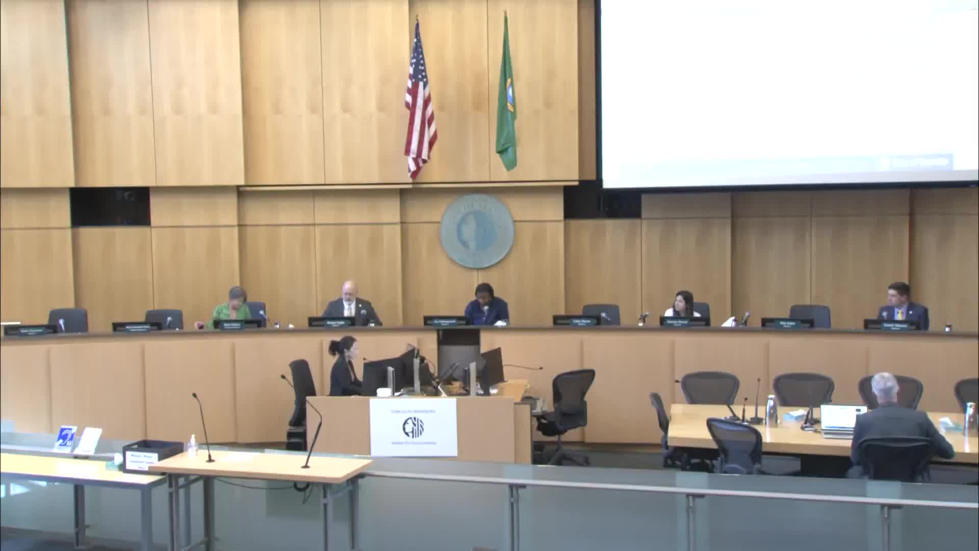 Committee advances Seattle Public Utilities package raising system development charges and enabling reimbursement areas; amendments adopted to expand income‑del