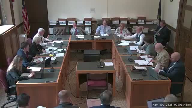 Committee approves Medicaid premium structure by household with six‑month reporting; concerns remain about access