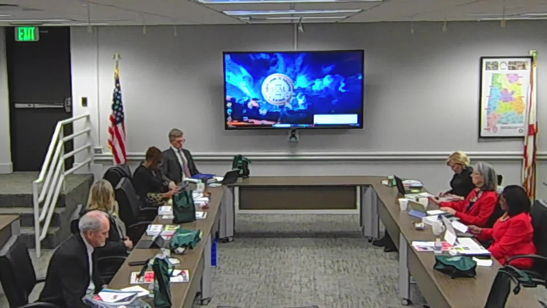 Liz Tracy leads prayer for students and educators at school meeting