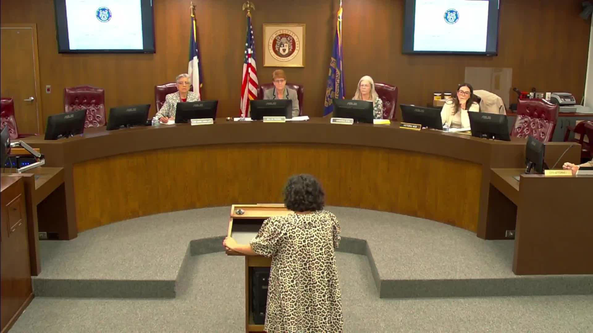 City struggles with low morale amid conspiracy theories and public criticism