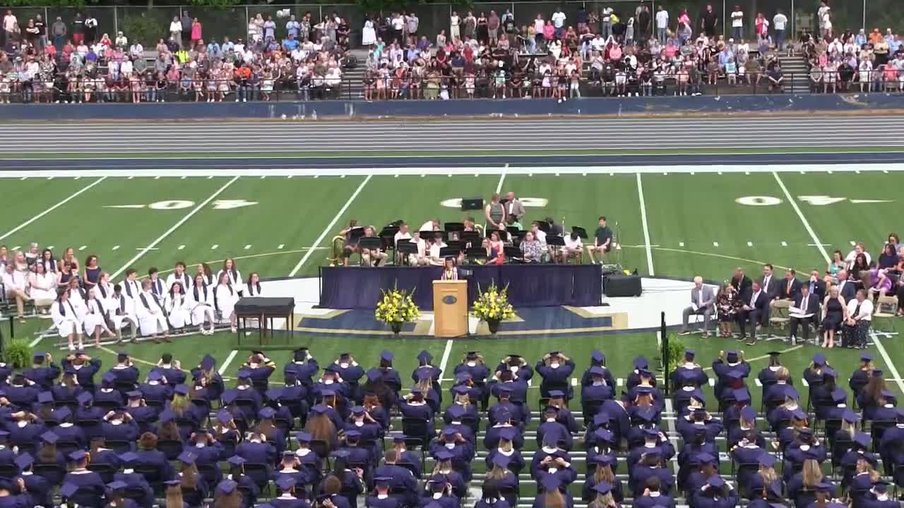 Taylor Brown introduces special guests at Alexander Central High School graduation