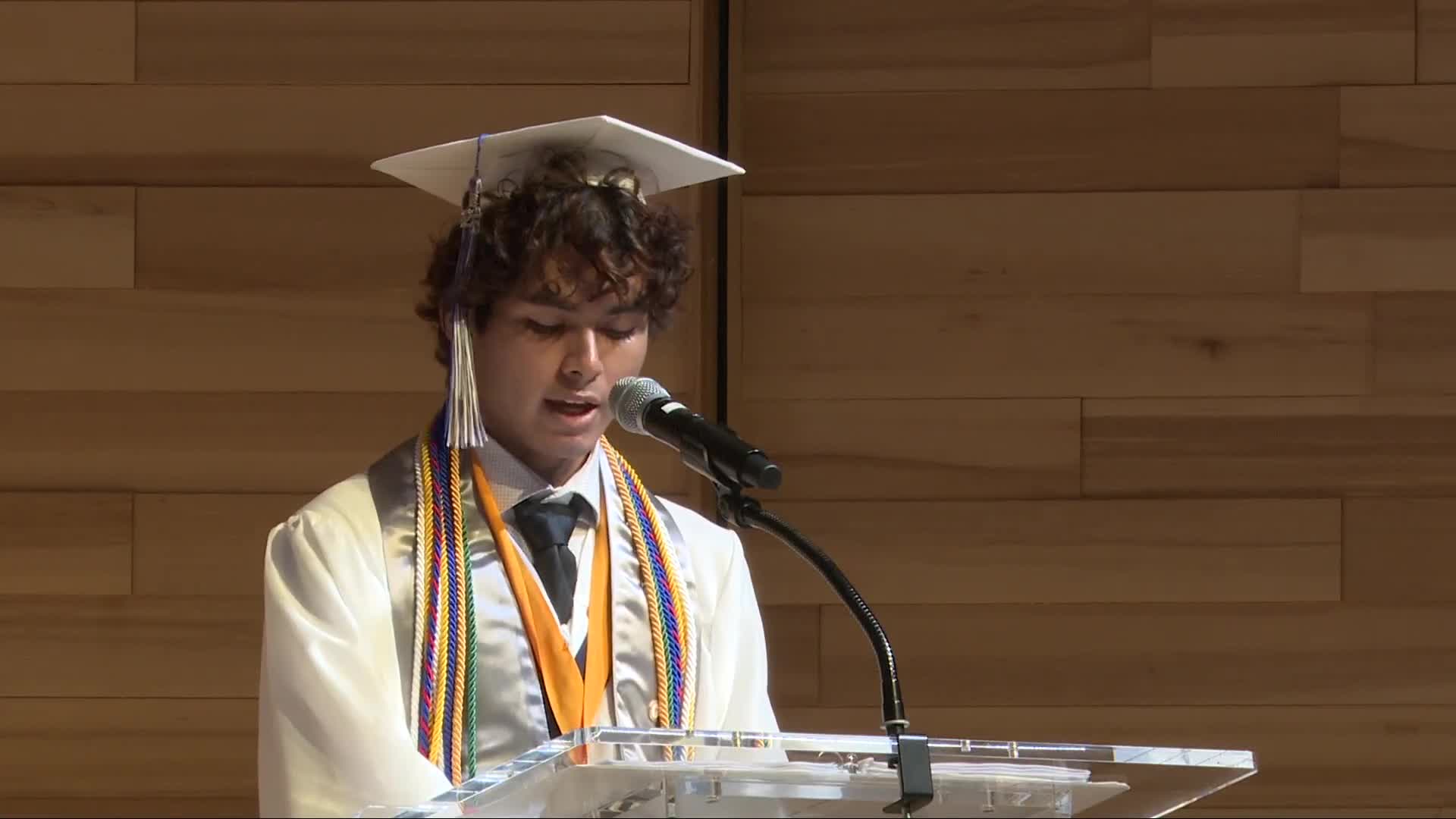 Senior Class Reporter Brianna Marukin addresses Class of 2025 during graduation