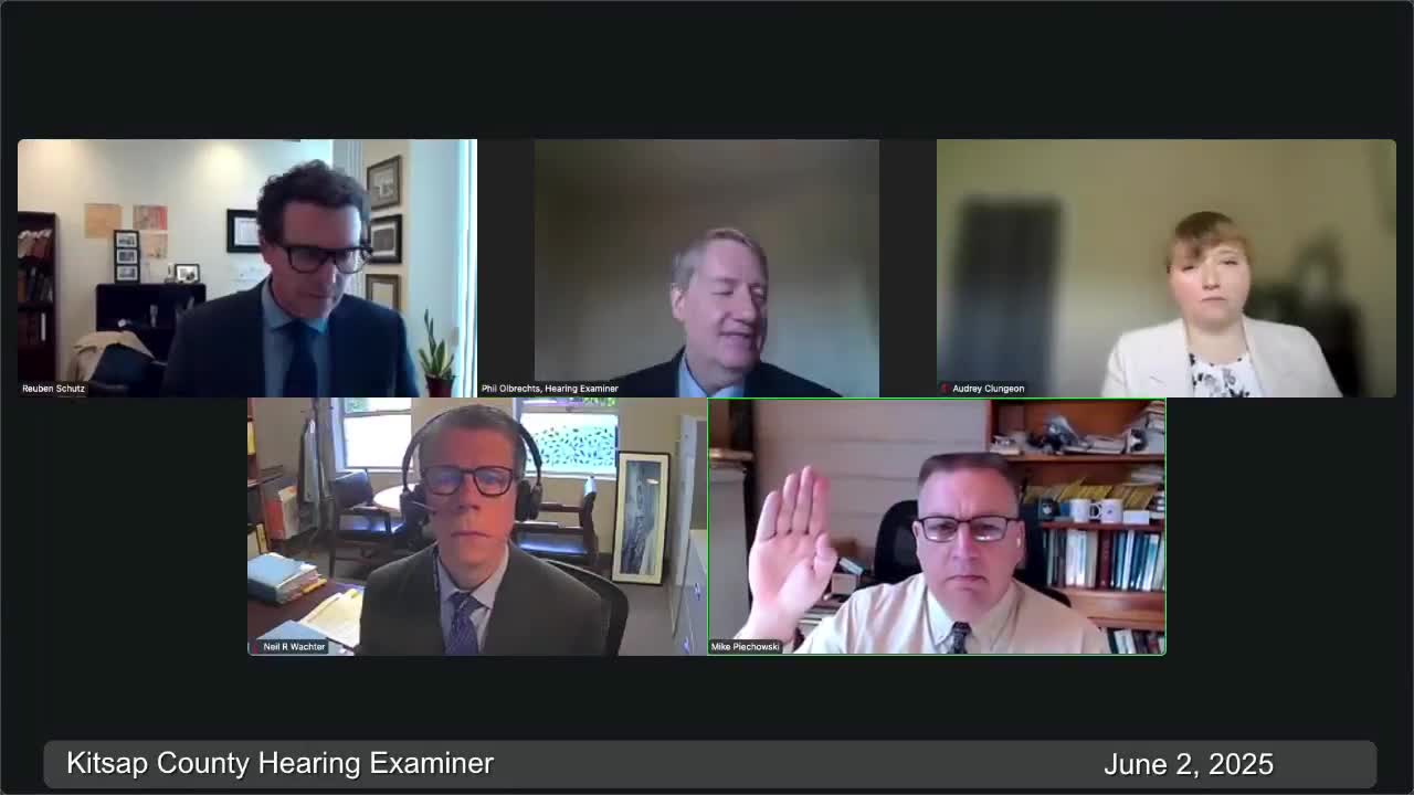 Hearing examiner told under‑building parking is infeasible at Silverdale site because of shallow artesian aquifer, cost and building-code impacts