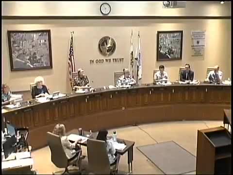 Council approves reclassification of three public‑works roles after heated budget and staffing debate