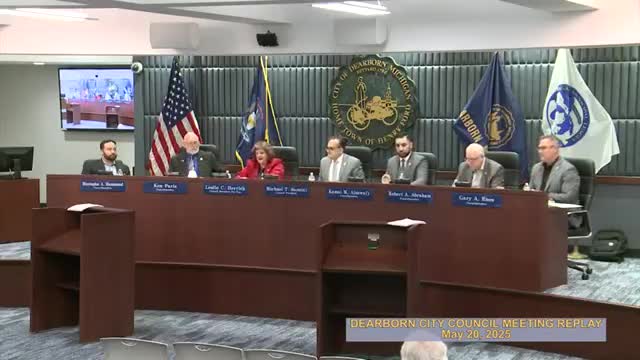 Father Kim Chase leads city council meeting invocation at Sacred Heart Catholic Church