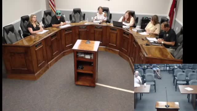 Community member praises local leaders for progress during public comment session