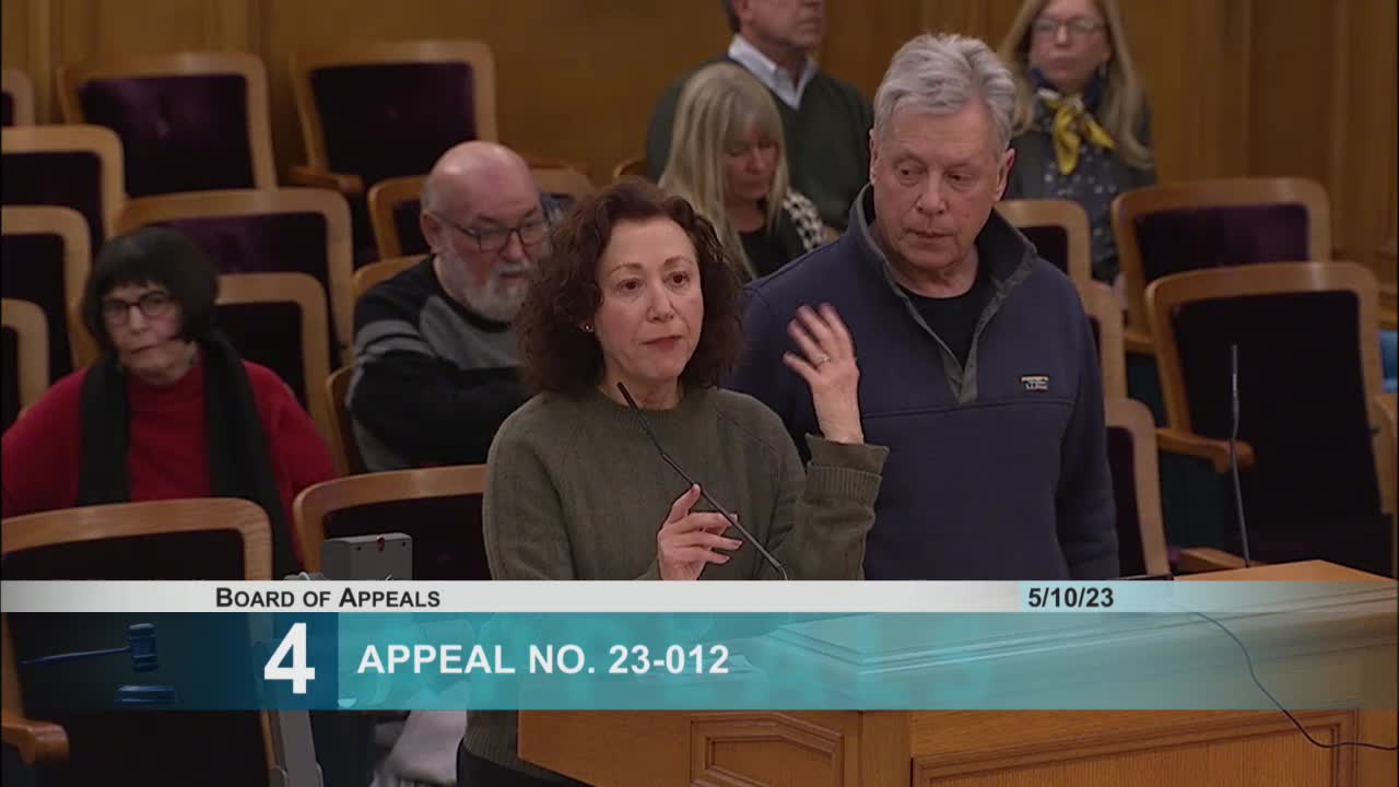 Neighbors Clash Over Paulson's Unauthorized 10-Foot Fence Installation