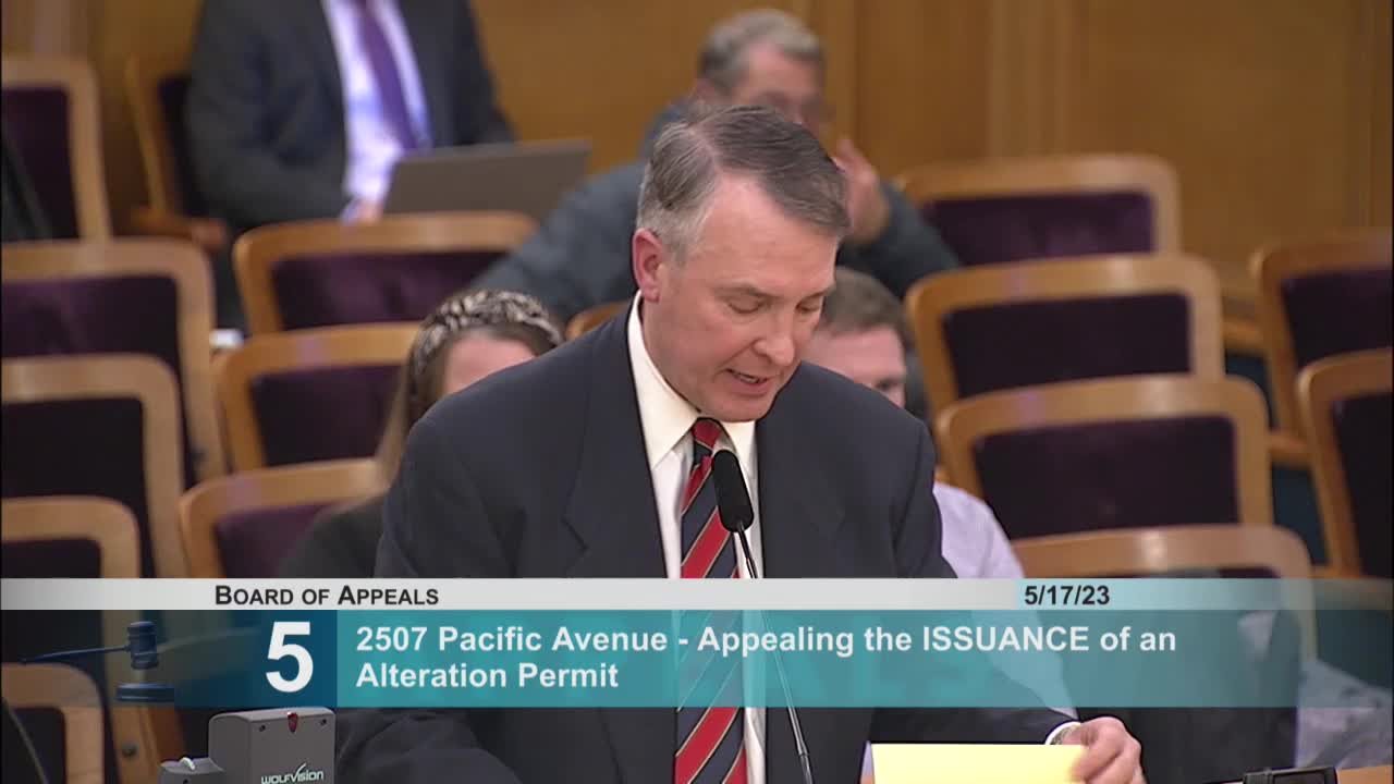 Building code expert challenges legality of structure violating property lines