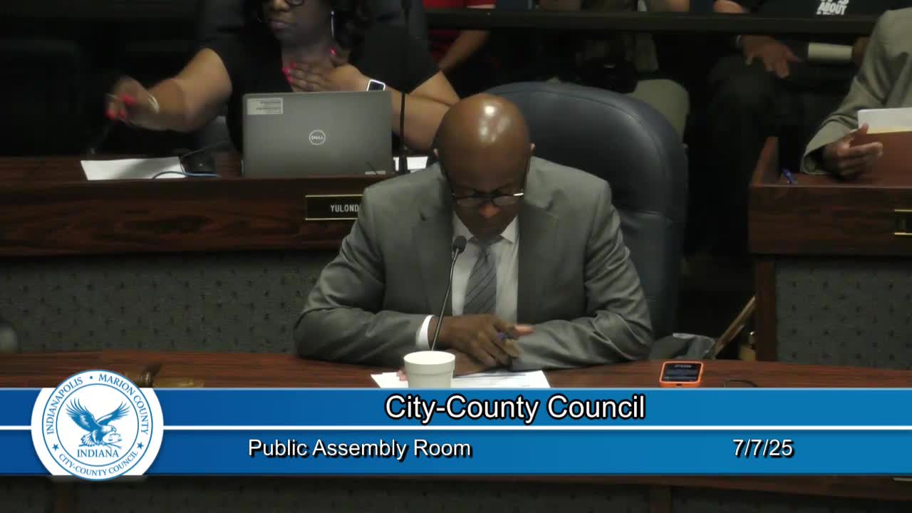 Pastor Alexia Ellis leads prayer for healing and unity at Indianapolis city council meeting
