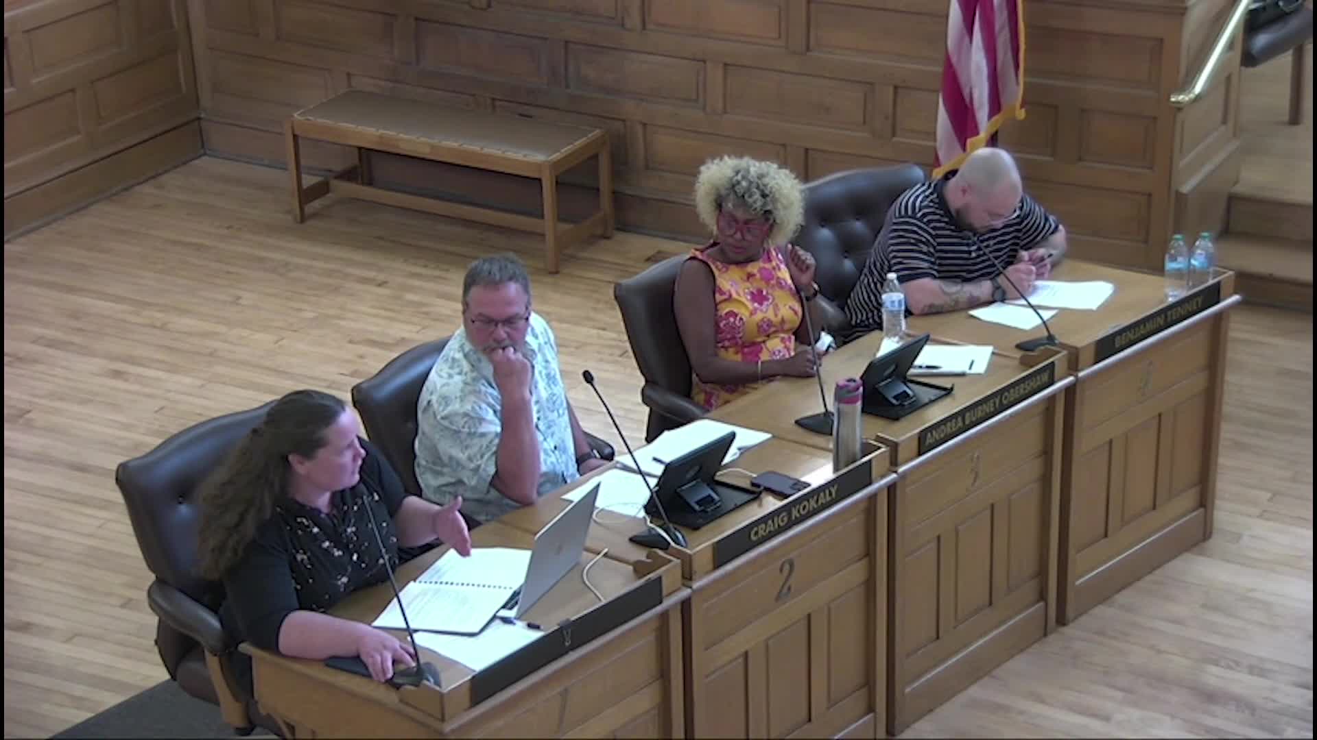 Commissioners debate residency verification and representation in local governance