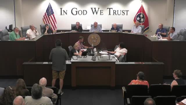 Local resident seeks clarity on property development plans at public hearing