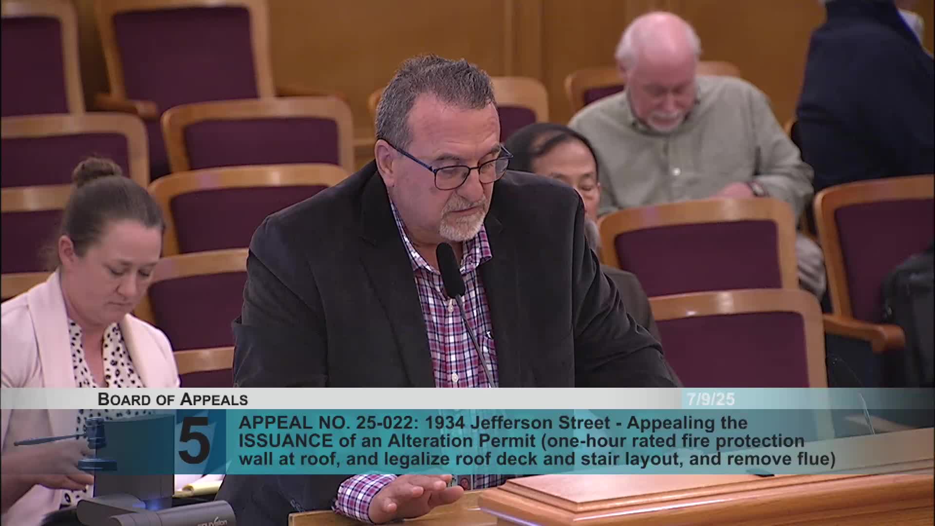 Commissioner Swick evaluates building code compliance for disputed deck constructions