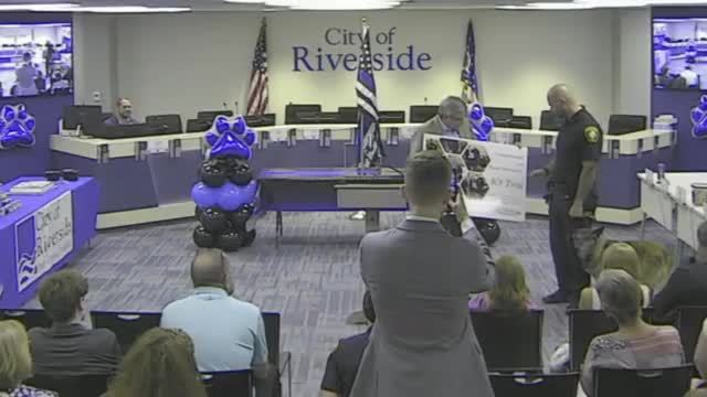 County Auditor honors officer Jackson and K9 Tina with seal of excellence