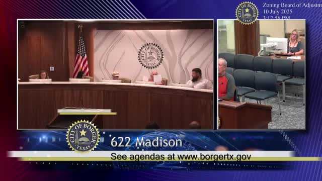 Variance approved for carport on irregular lot after staff cites rear-access hardship