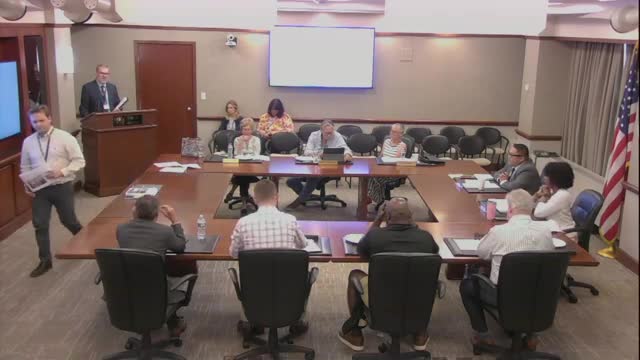 Commission reviews opaque storefronts and temporary window-sign rules; staff to simplify enforcement approach