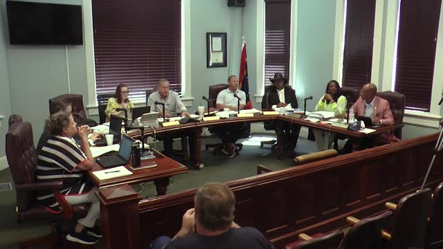 City counselors discuss security measures and camera installations at Cambridge Apartments
