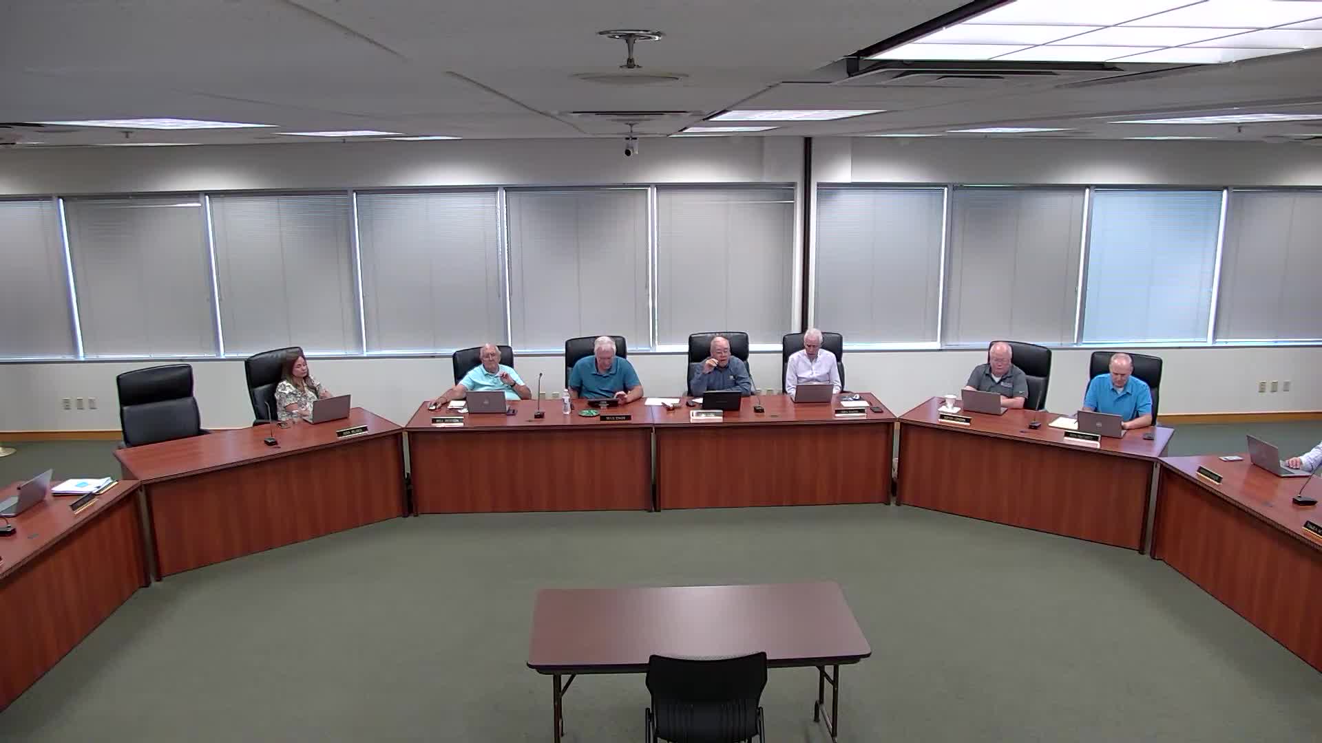 Board considers fees: communication charge and optional device protection plan for grades 5–12