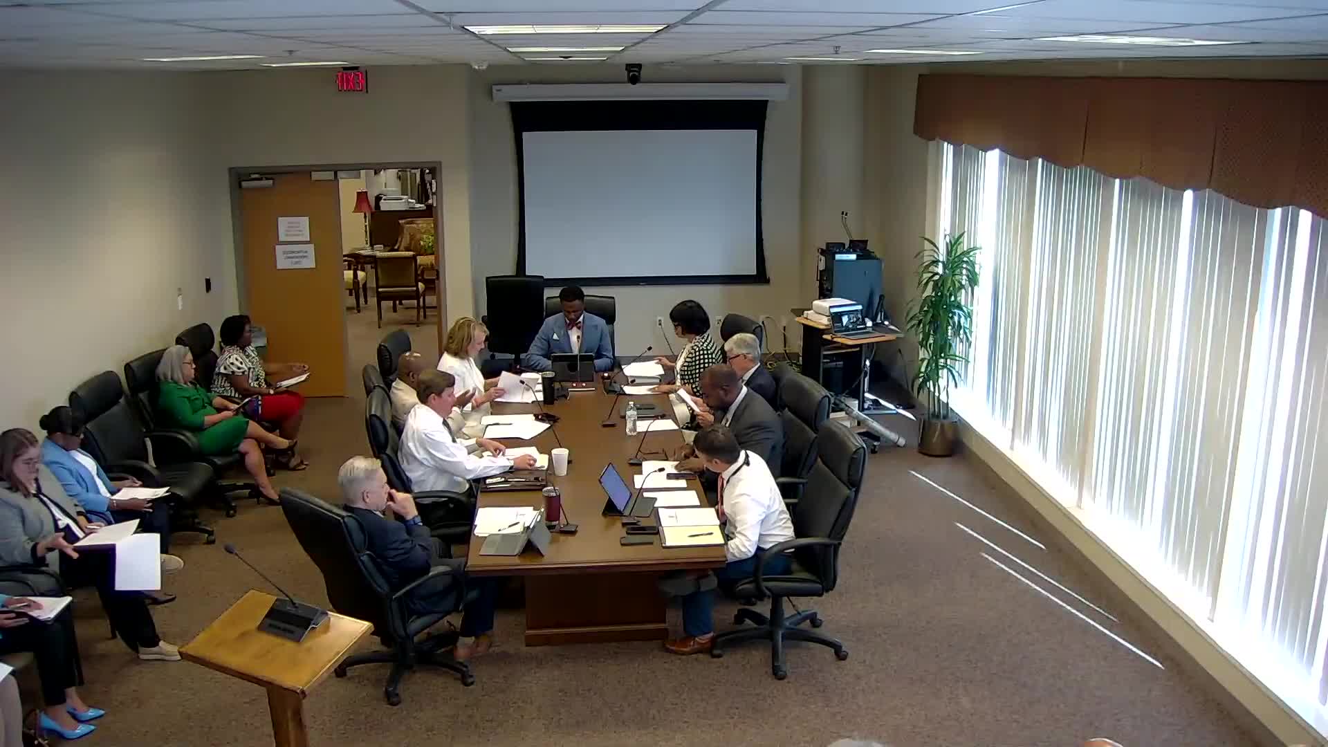 Council schedules public hearings for rezoning and permit applications, announces routine agenda items