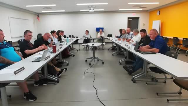 Board discusses naming rights for memorializing longtime staff member, delays vote pending policy review