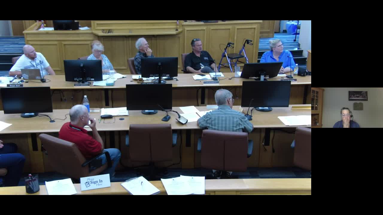 County Employee Critiques HPS Insurance Plan and Urges Wage Increases