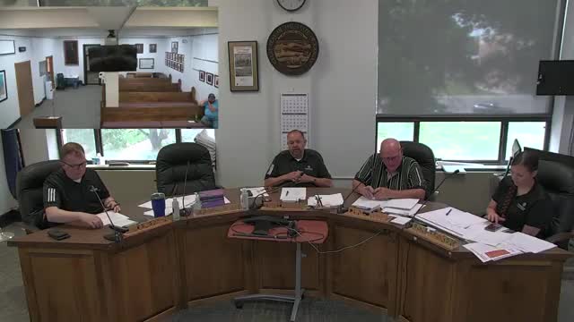 Commissioners discuss bidding thresholds and a draft county purchasing policy; statute cited at $25,000