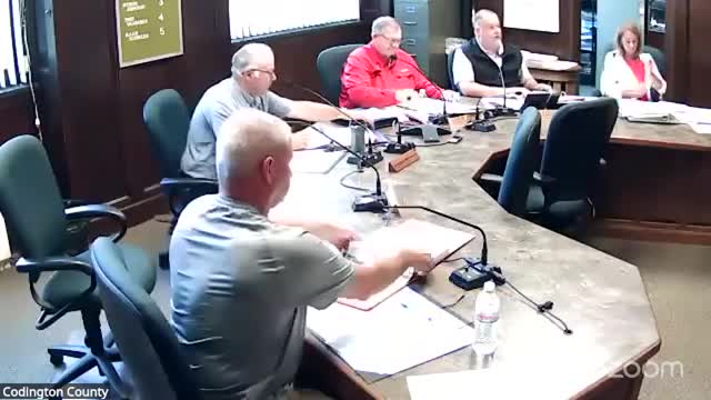 Sheriff briefs commissioners on jail population, budgets; board approves five-year Axon taser contract and training dummy purchase