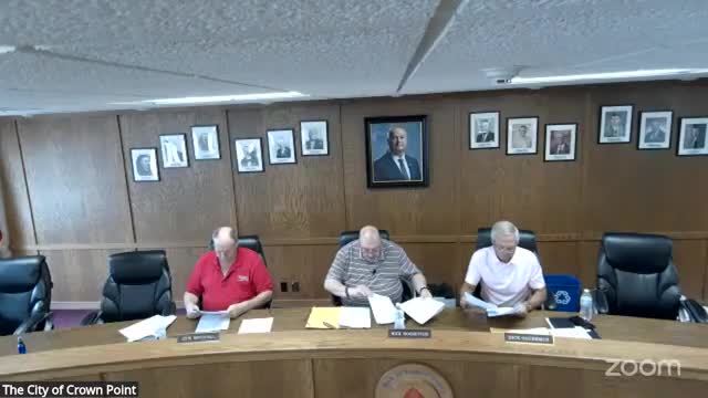 Board approves variance allowing shared access and side‑yard paving for Adams Masonry site