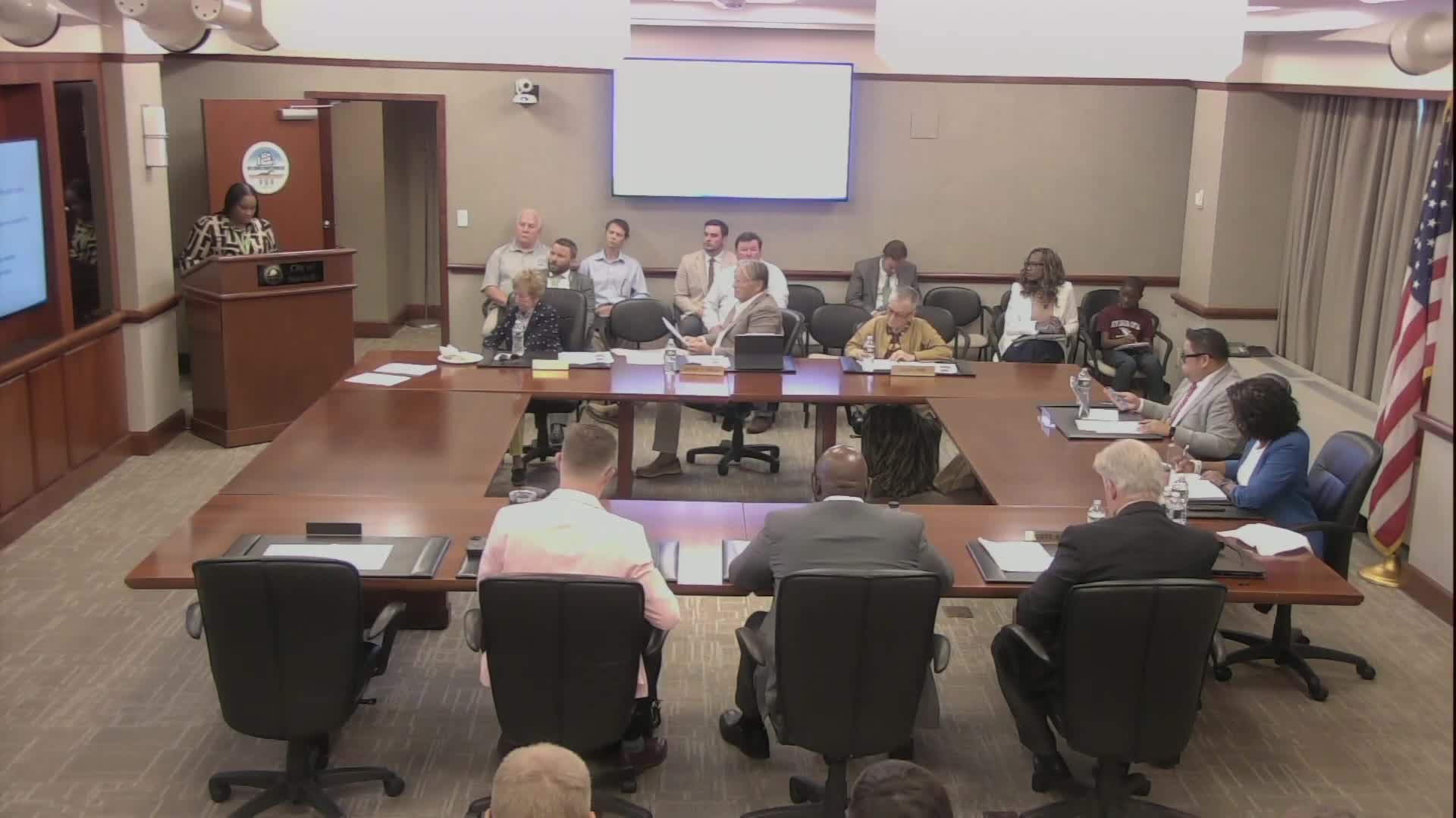 Applicant seeks conditional use permit for flea market and banquet hall; neighbors raise parking and safety concerns