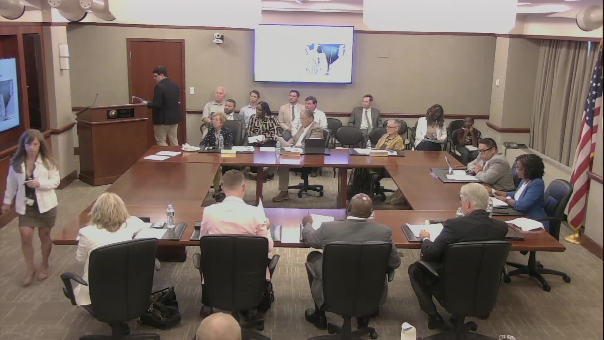 Rezoning sought to restore industrial use at former waterfront parking lot; staff cites Chesapeake Bay, cleanup proffers